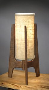 A lamp made of wood and fabric.